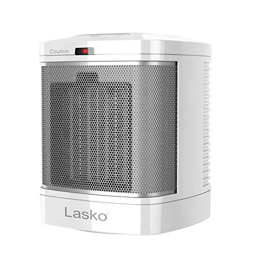 Lasko small white ceramic heater sitting on bathroom counter